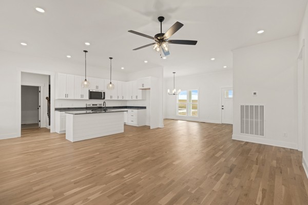 5558 Borthick Road Springfield, TN 37172 - Photo 7 of 43 a view of kitchen with stove and wooden floor