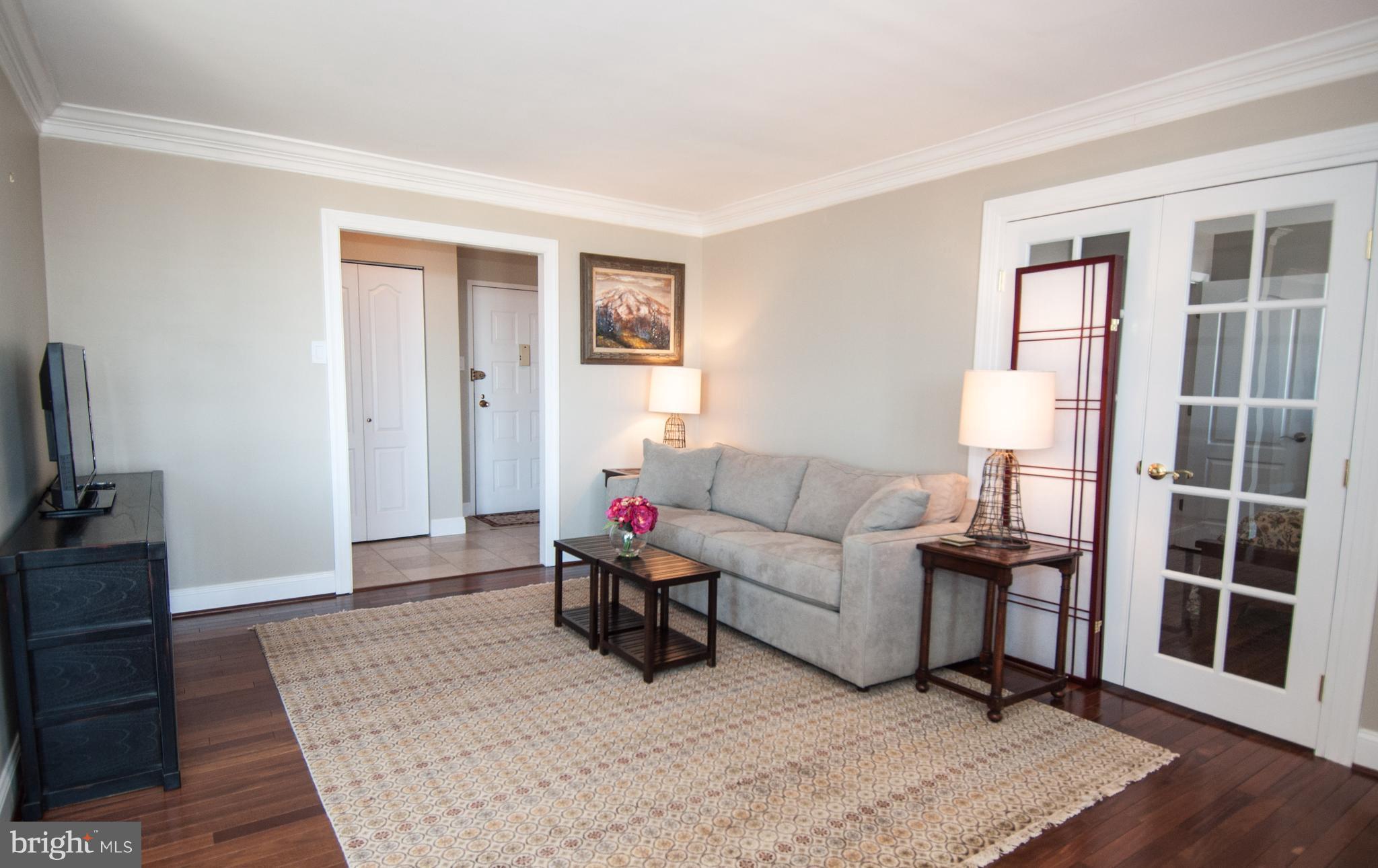 6800 Fleetwood Road, Unit 1017 McLean, VA 22101 - Photo 11 of 24 a living room with furniture window and wooden floor