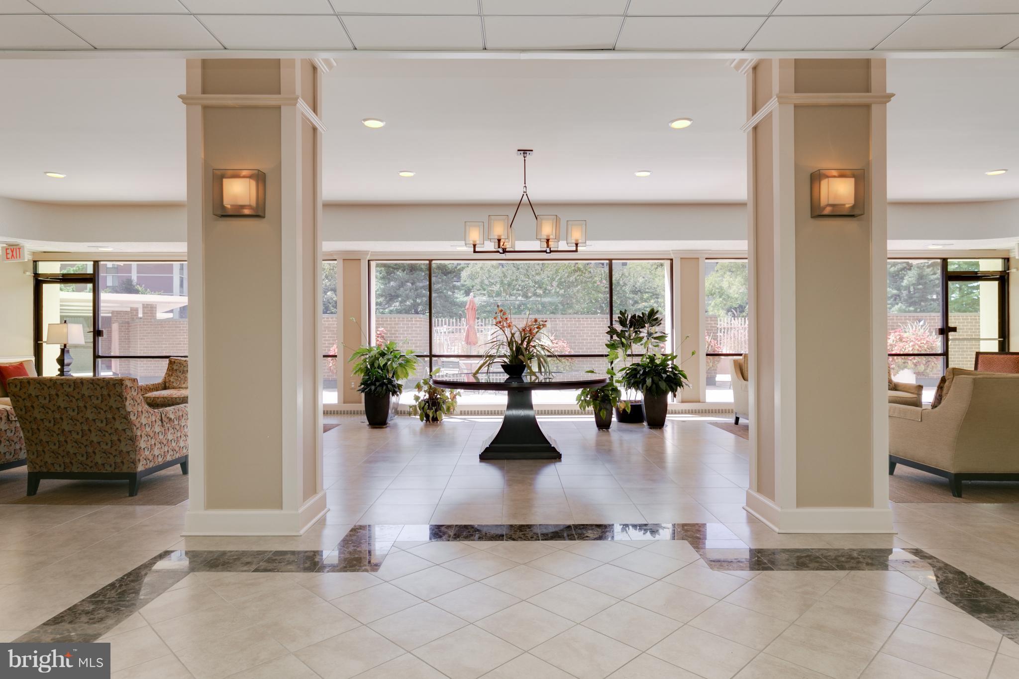6800 Fleetwood Road, Unit 1017 McLean, VA 22101 - Photo 19 of 24 a lobby with furniture and a chandelier