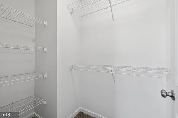 a view of a room with racks on the wall
