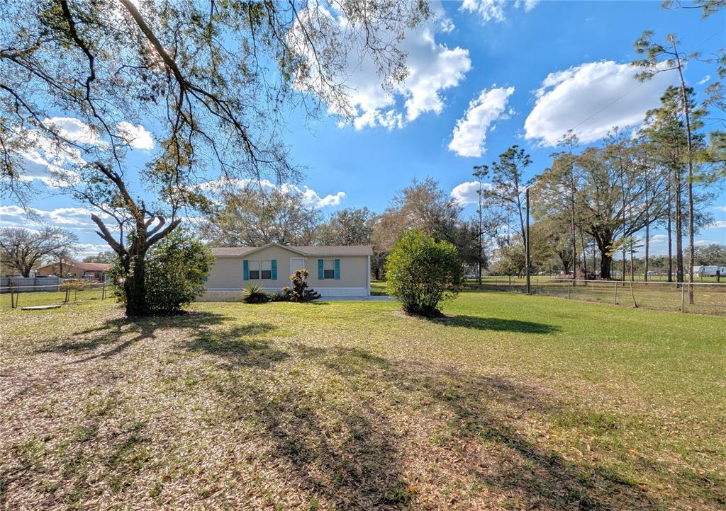 9403 South County Line Road Lithia, FL 33547 - Photo 1 of 1 a view of a house with a yard