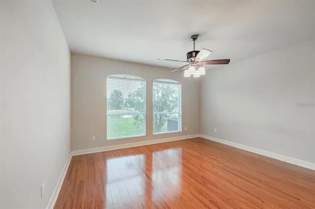 a spacious bathroom with a granite countertop tub sink shower and mirror