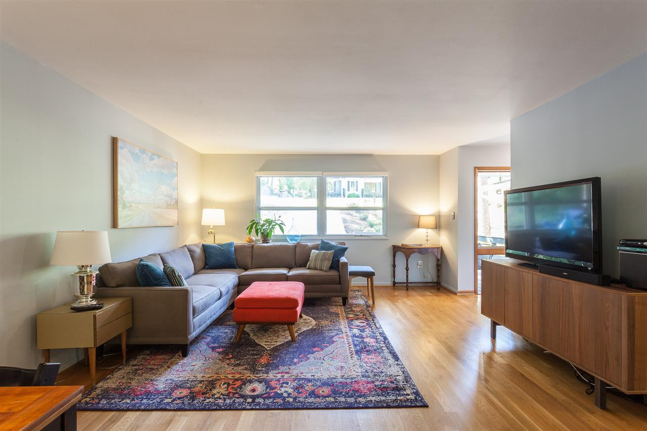 Check out the gleaming hardwood floors and large windows! Living/ Dining Room