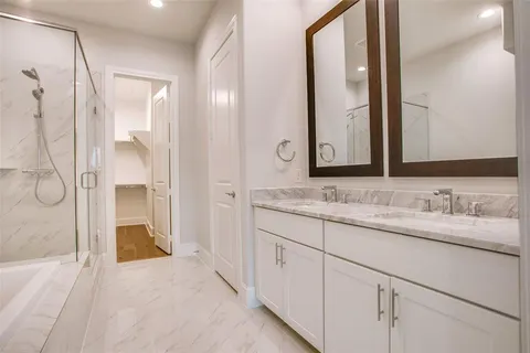 a bathroom with a tub and shower