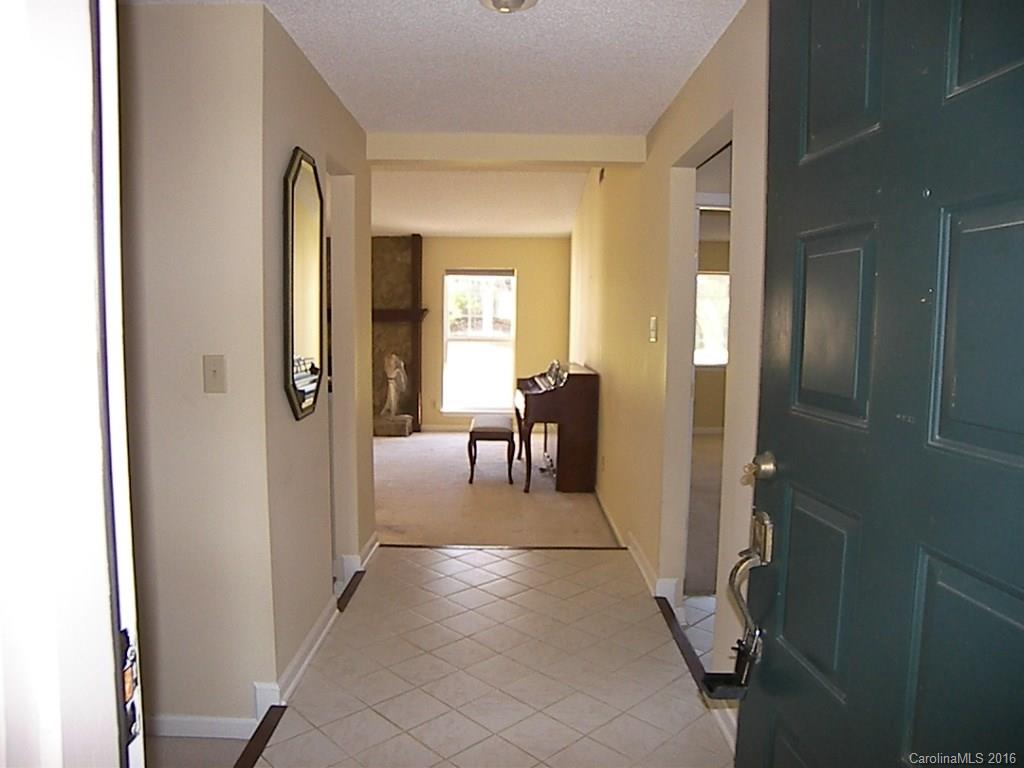 9913 Fairway Ridge Road Charlotte, NC 28277 - Photo 2 of 18 a view of a hallway with furniture and a livingroom view