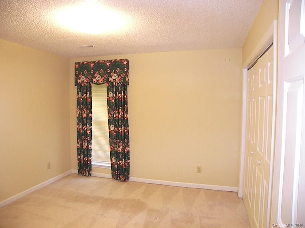 9913 Fairway Ridge Road Charlotte, NC 28277 - Photo 12 of 18 an empty room with windows
