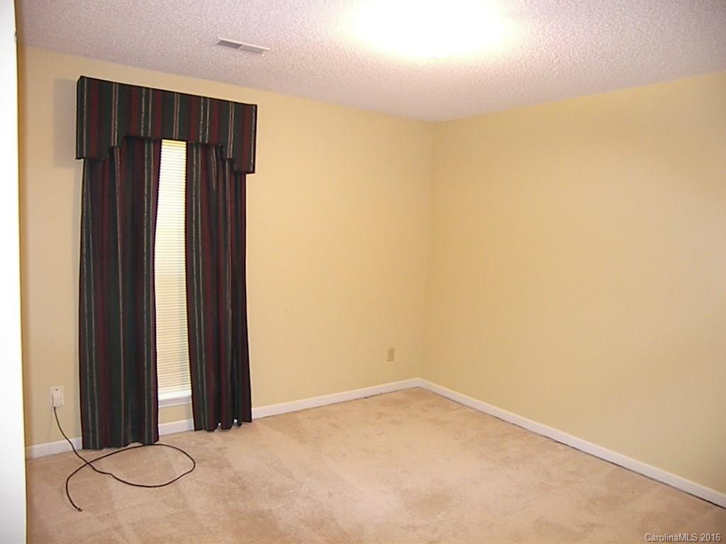 9913 Fairway Ridge Road Charlotte, NC 28277 - Photo 13 of 18 an empty room with a window