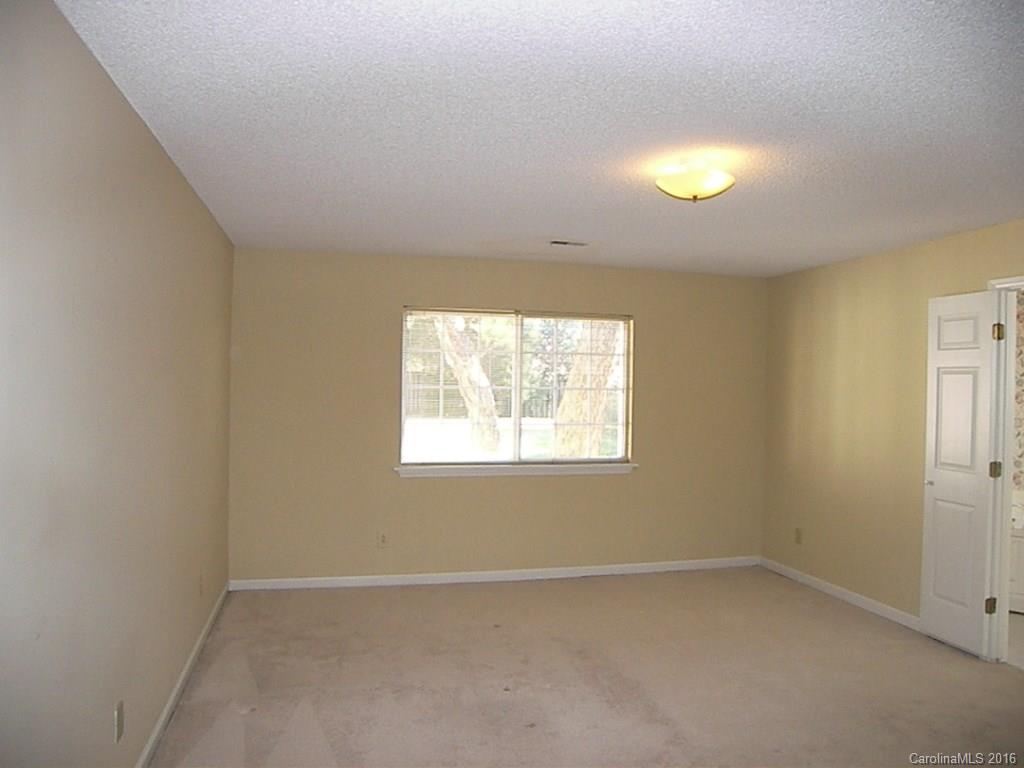 9913 Fairway Ridge Road Charlotte, NC 28277 - Photo 15 of 18 an empty room with a window