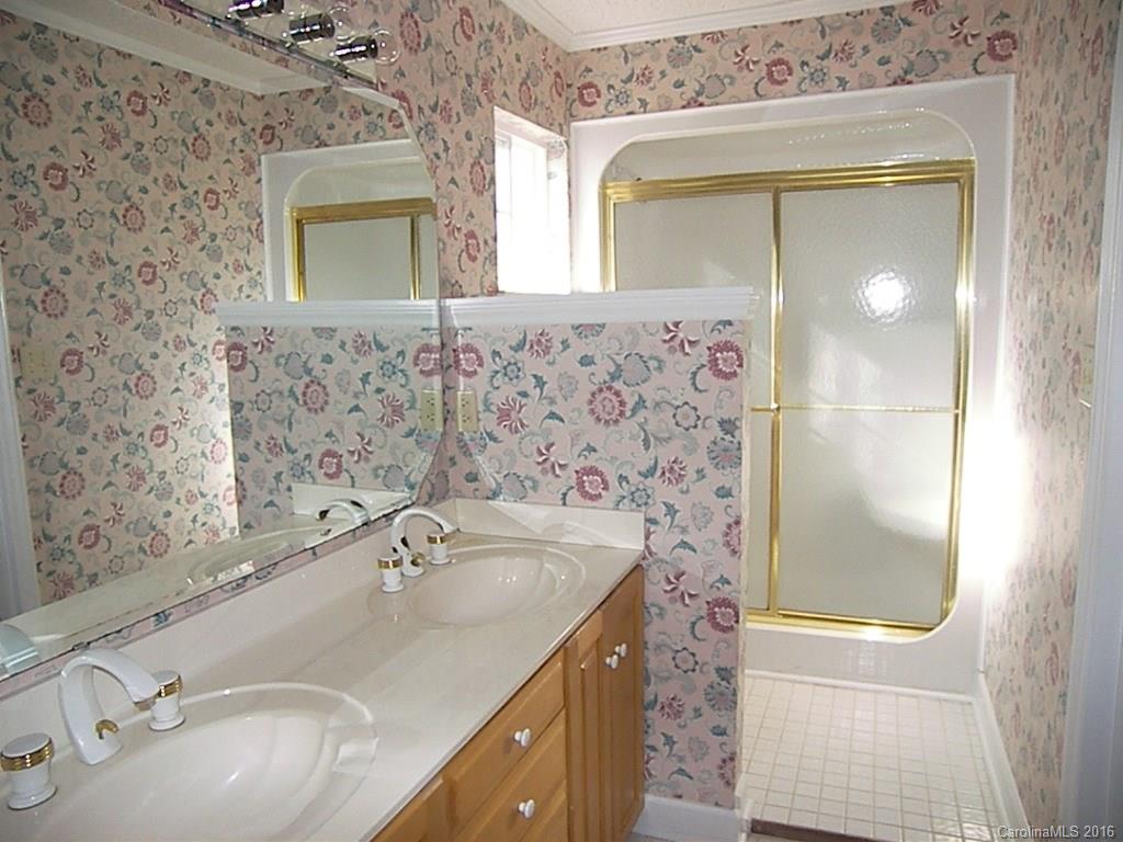 9913 Fairway Ridge Road Charlotte, NC 28277 - Photo 17 of 18 a bathroom with a sink and a mirror