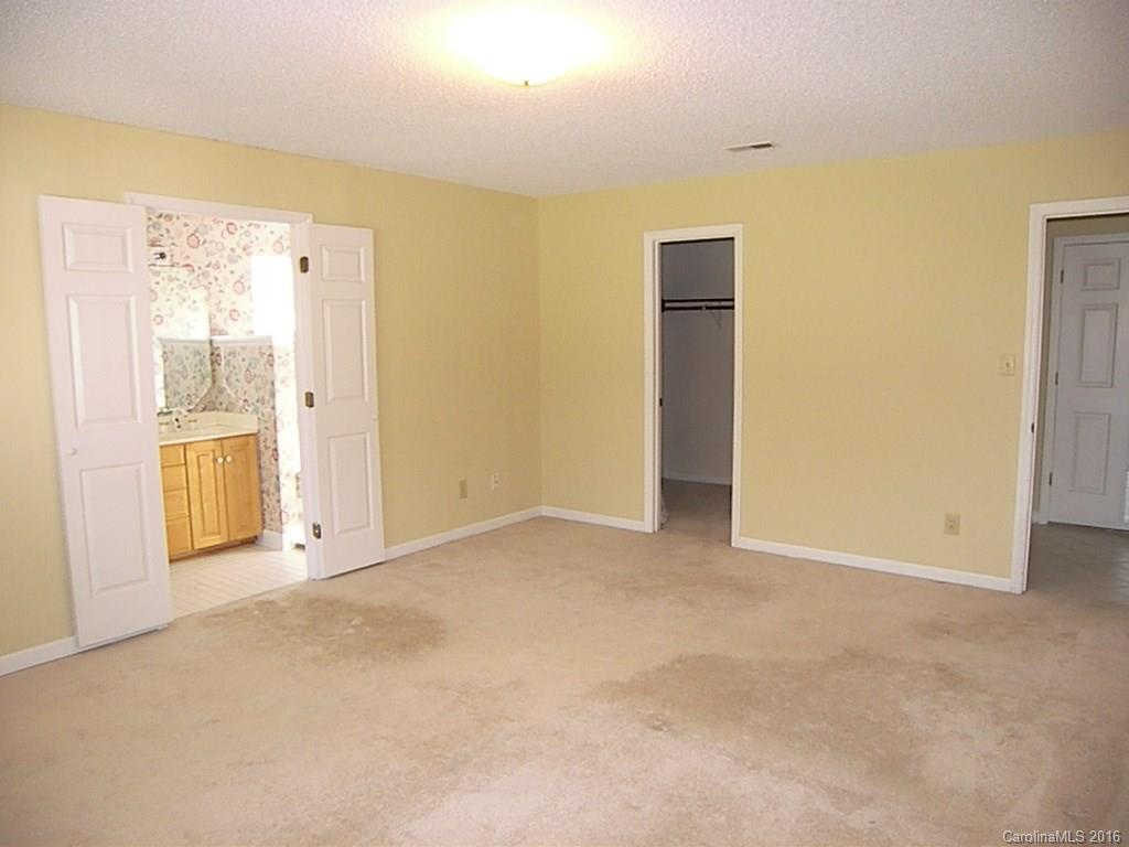 9913 Fairway Ridge Road Charlotte, NC 28277 - Photo 18 of 18 an empty room with windows and closet