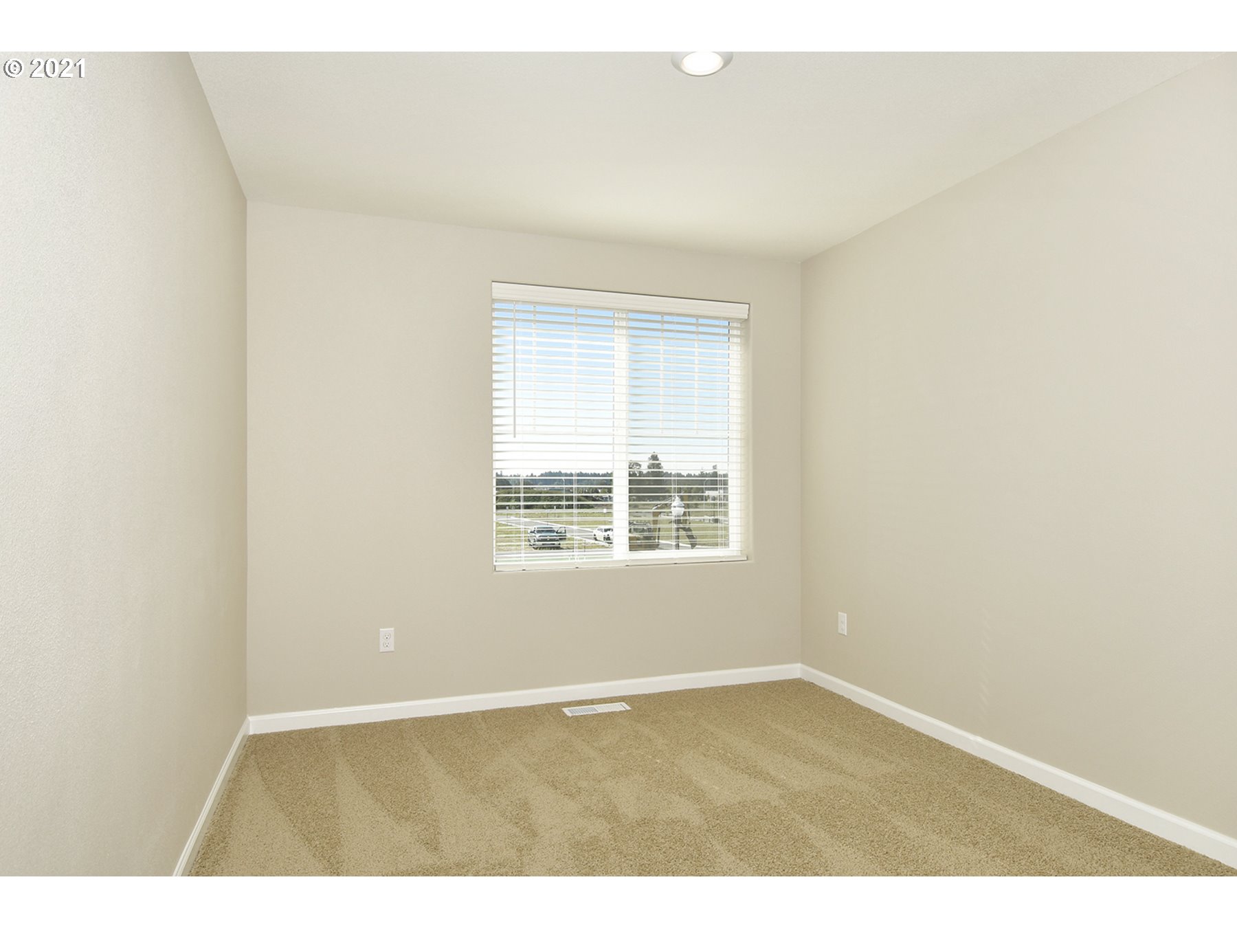 7011 Northeast 156th Place Vancouver, WA 98682 - Photo 15 of 21 an empty room with wooden floor and windows