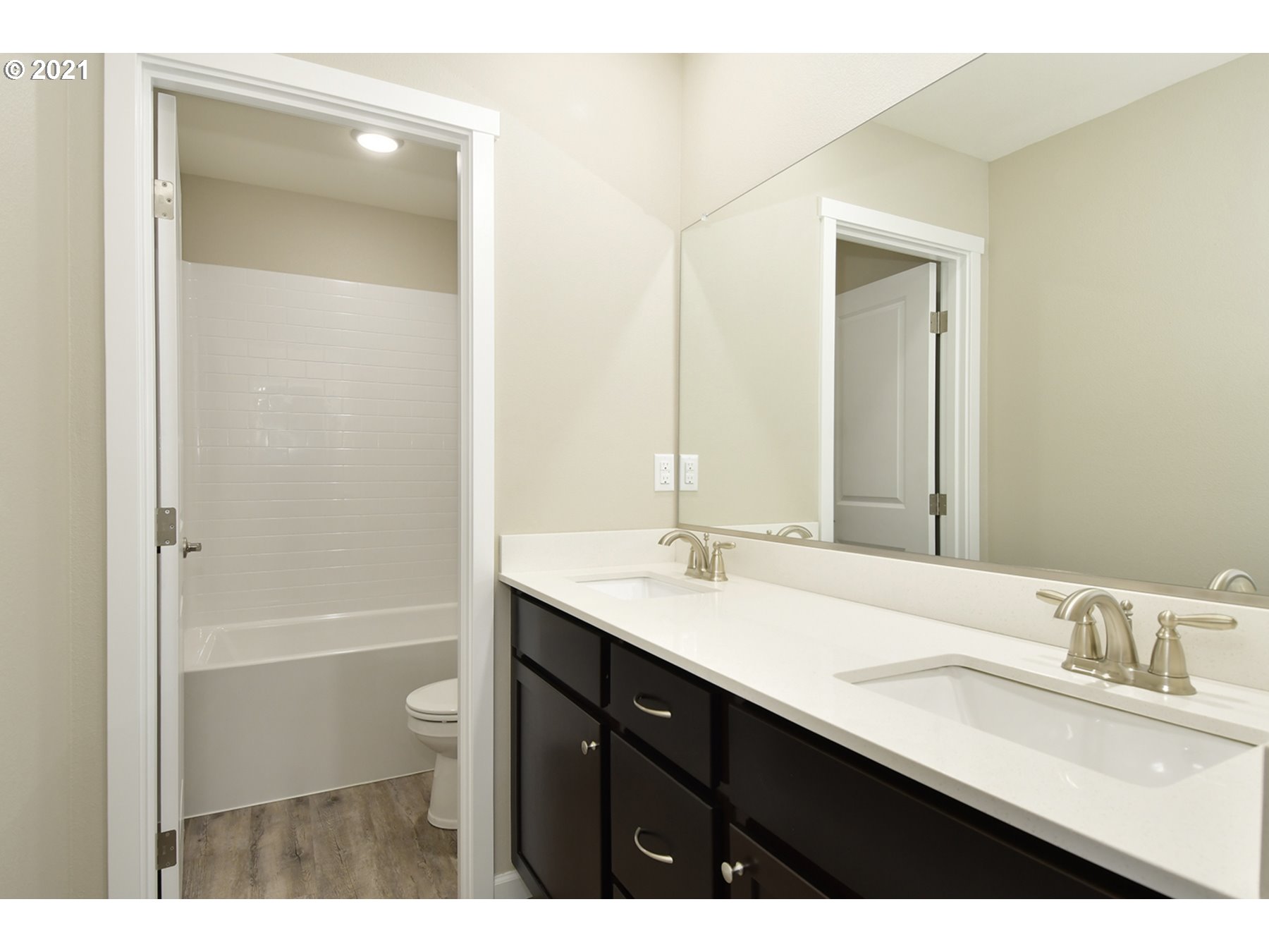 7011 Northeast 156th Place Vancouver, WA 98682 - Photo 17 of 21 a bathroom with a sink a toilet a shower and a mirror