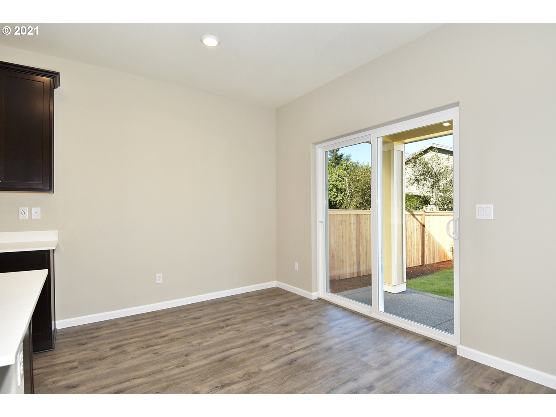 7011 Northeast 156th Place Vancouver, WA 98682 - Photo 5 of 21 a view of an empty room with wooden floor and a window