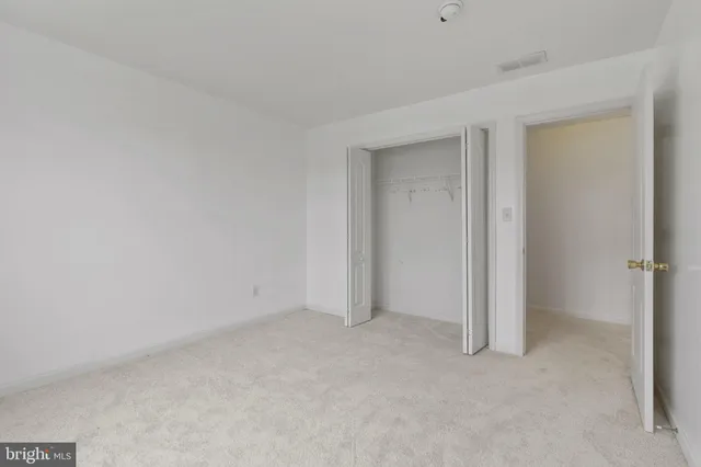 a bathroom with a sink toilet a mirror and shower