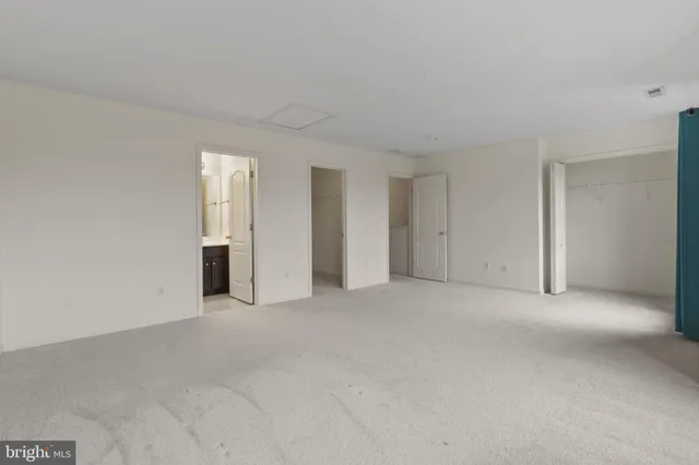 a view of an house with backyard space and balcony