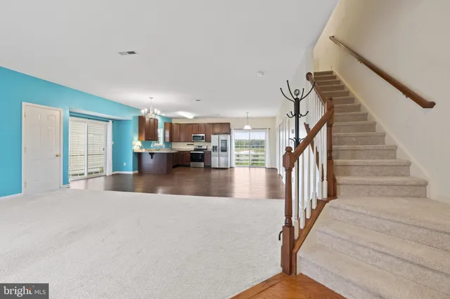a view of livingroom with furniture and staircase