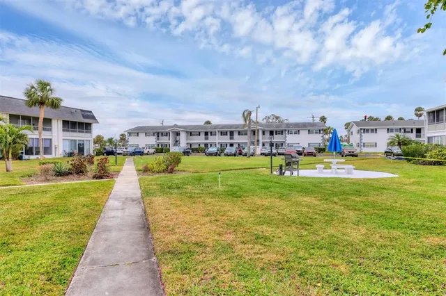 a view of a house with a big yard
