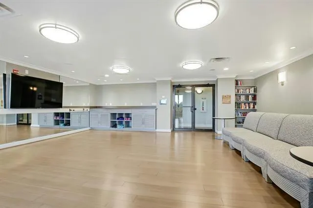 a view of a livingroom with furniture and a flat screen tv