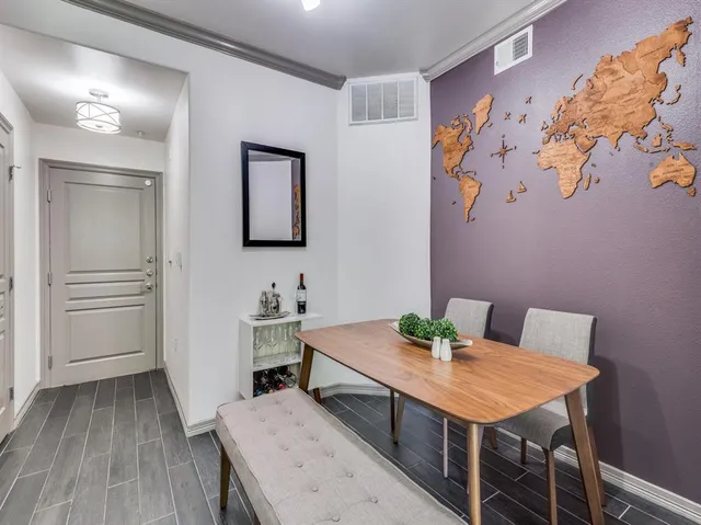 a view of a room with furniture and wooden floor