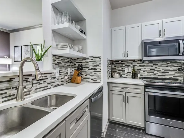 a kitchen with a stove and a sink