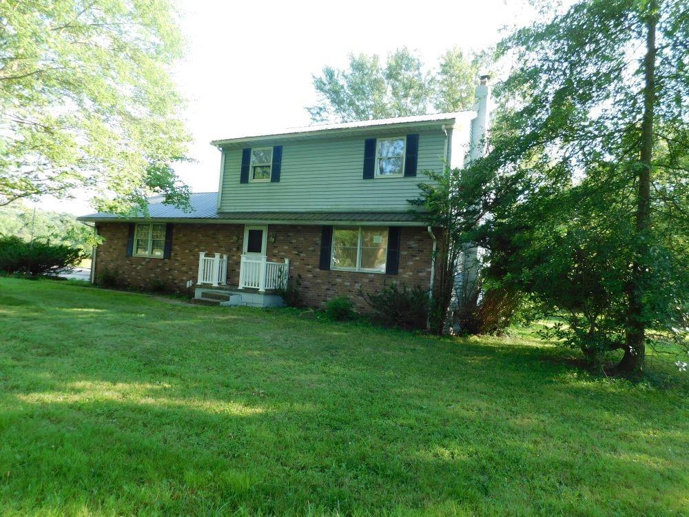 177 Fullingmill Road Mercer, PA 16137 - Photo 1 of 12 a view of a house with backyard and garden