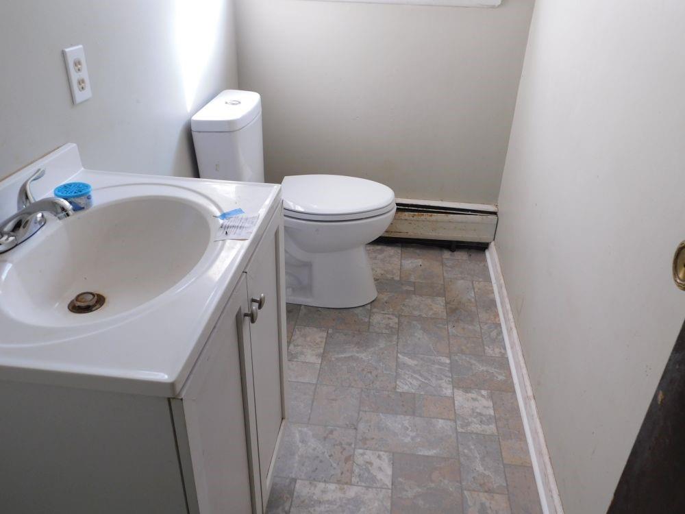 177 Fullingmill Road Mercer, PA 16137 - Photo 7 of 12 a bathroom with a sink a toilet and a tub