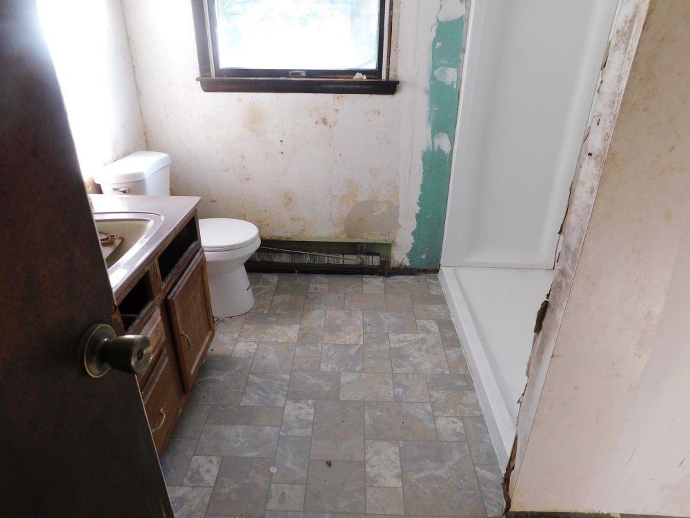 177 Fullingmill Road Mercer, PA 16137 - Photo 8 of 12 a bathroom with a sink and a toilet