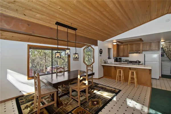 a very nice looking dining room with a table and chairs