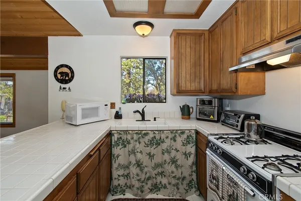a kitchen with a stove and a sink