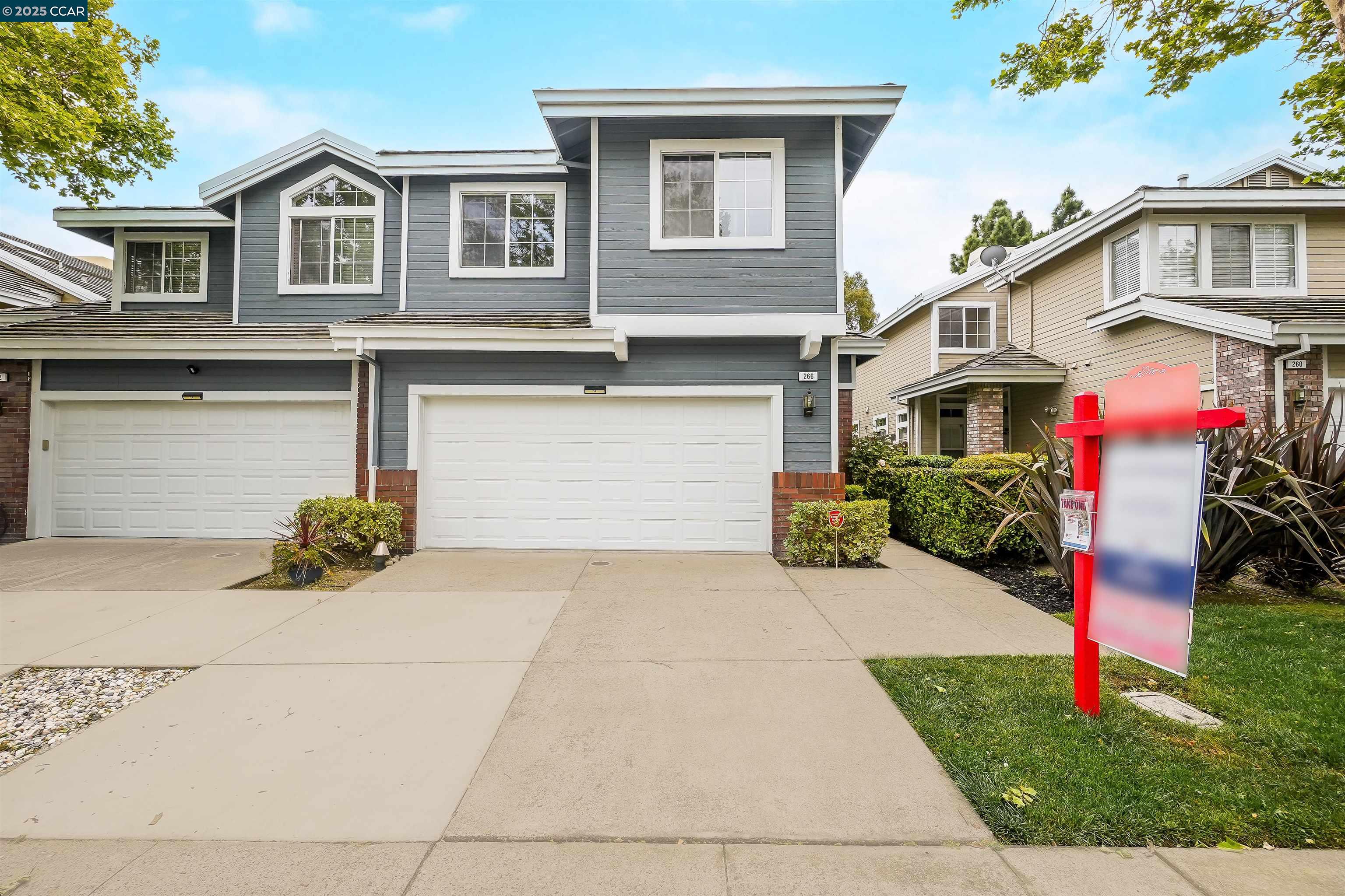 a front view of a house with yard