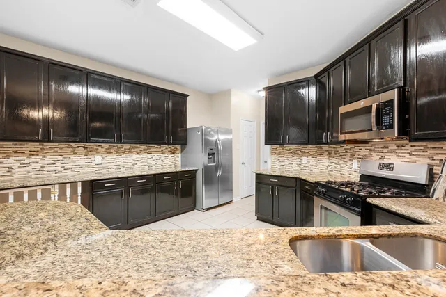 a view of a living room with a flat screen tv