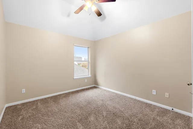 a bathroom with a granite countertop sink and a mirror with toilet