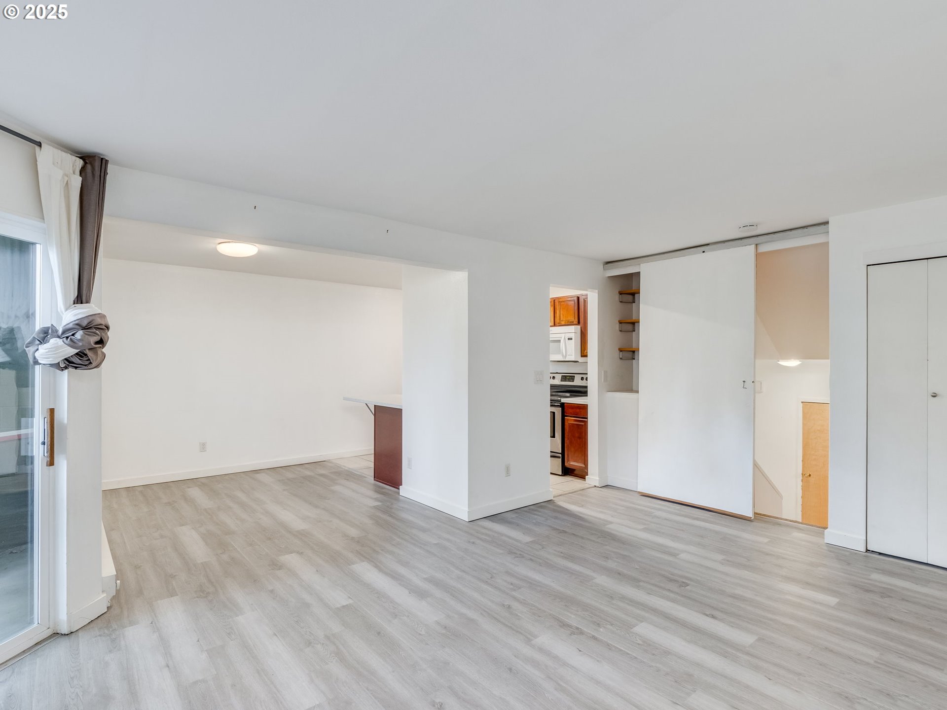 6220 Southwest Capitol Highway, Unit 7 Portland, OR 97239 - Photo 11 of 31 a view of empty room with wooden floor