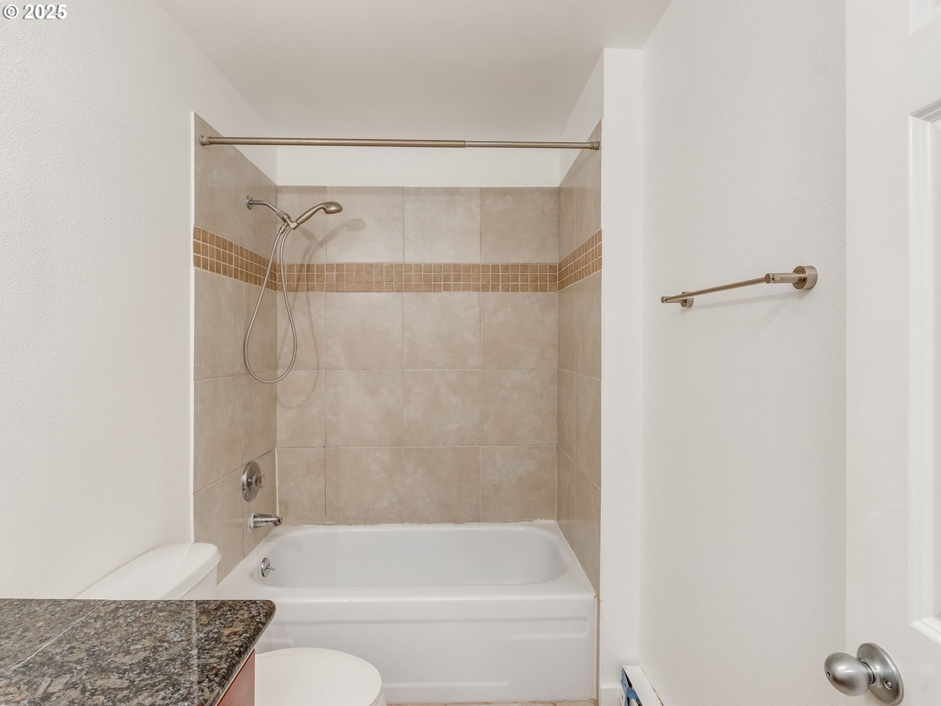 6220 Southwest Capitol Highway, Unit 7 Portland, OR 97239 - Photo 25 of 31 a bathroom with a shower and a bath tub