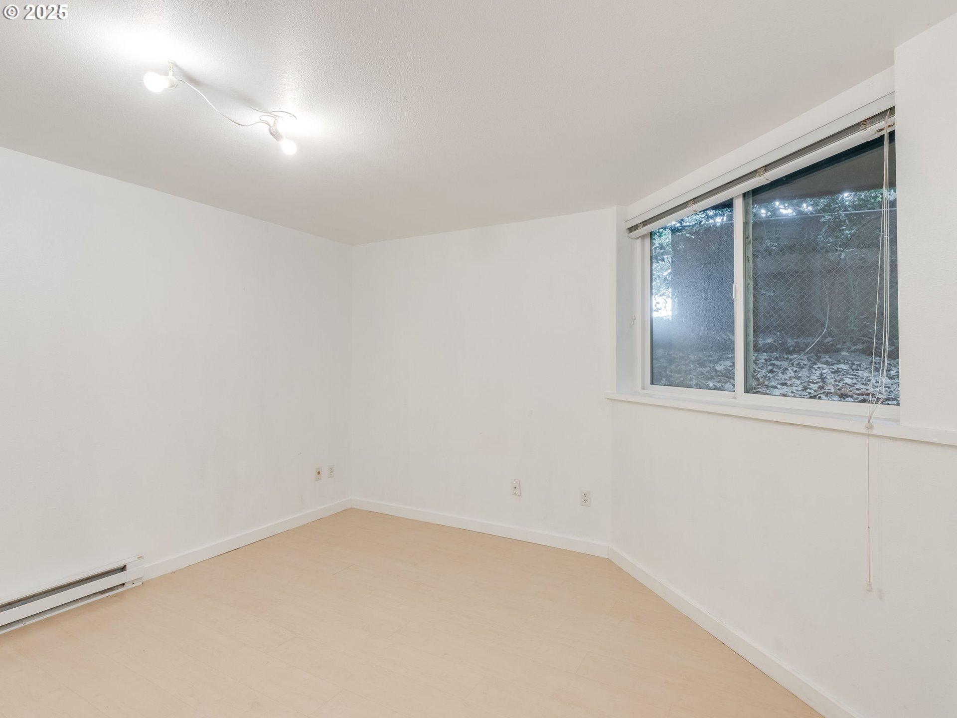 6220 Southwest Capitol Highway, Unit 7 Portland, OR 97239 - Photo 26 of 31 an empty room with a window