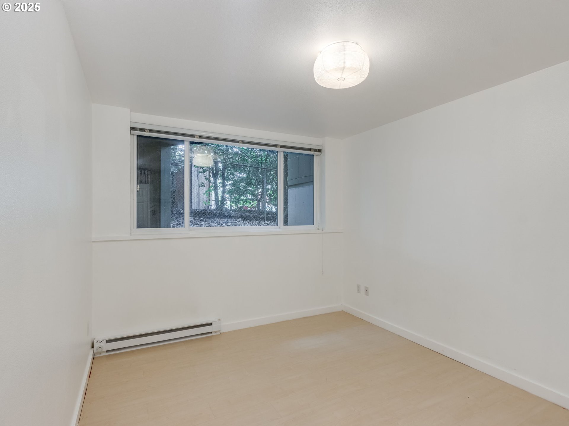 6220 Southwest Capitol Highway, Unit 7 Portland, OR 97239 - Photo 29 of 31 an empty room with a window