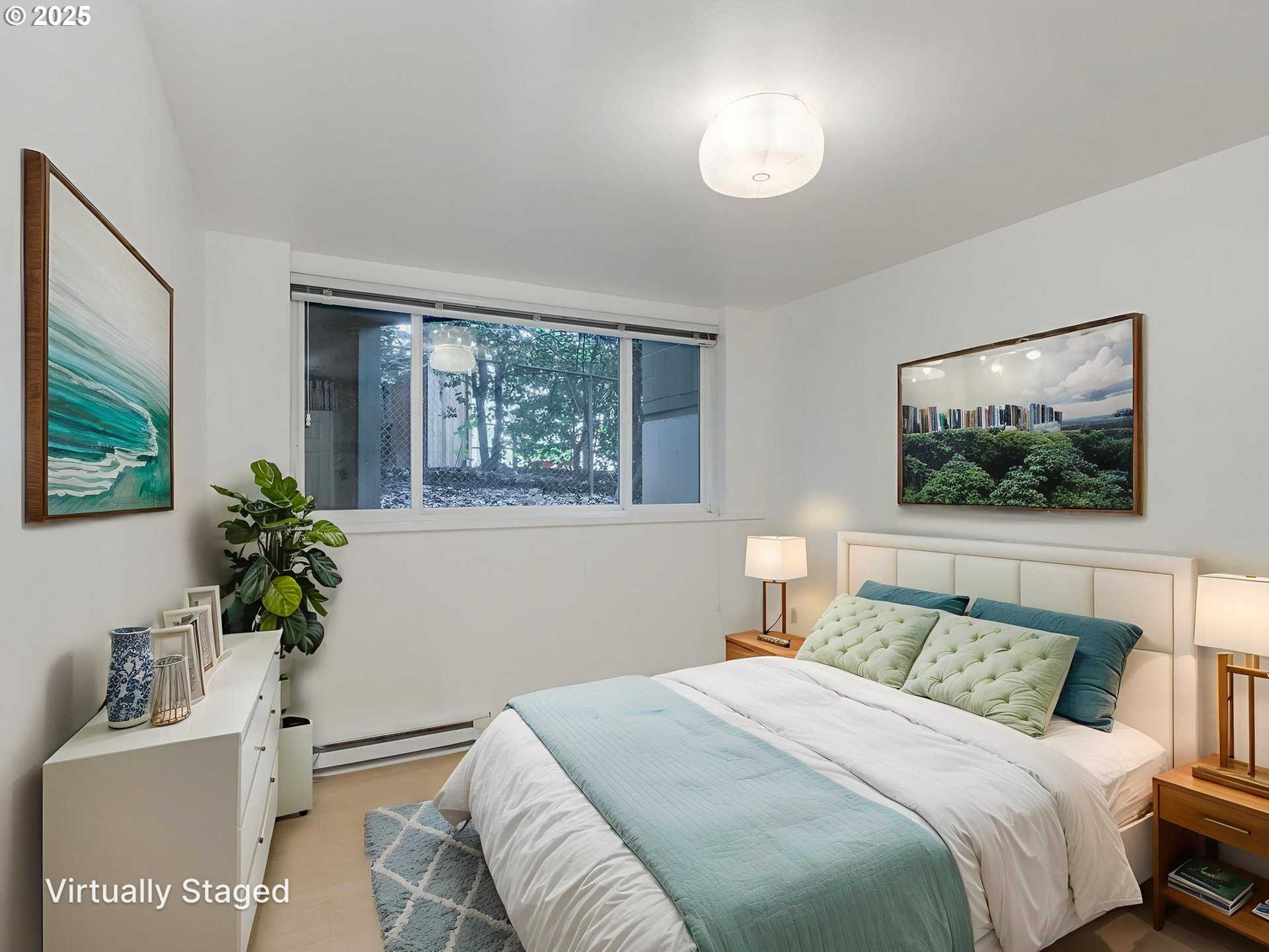 6220 Southwest Capitol Highway, Unit 7 Portland, OR 97239 - Photo 30 of 31 a bedroom with a bed and a potted plant