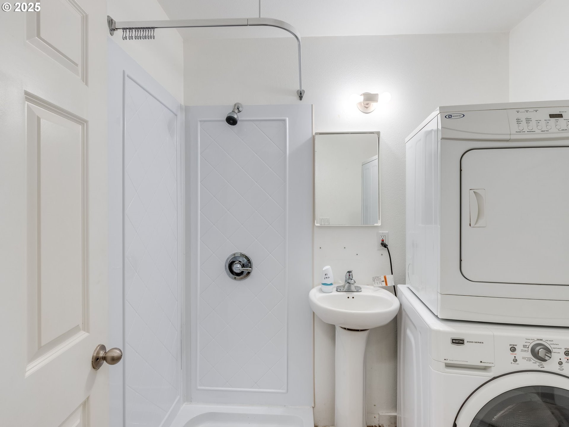 6220 Southwest Capitol Highway, Unit 7 Portland, OR 97239 - Photo 5 of 31 a bathroom with a sink a toilet and shower
