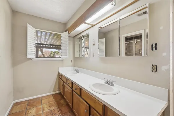 a bathroom with a sink and a bathtub