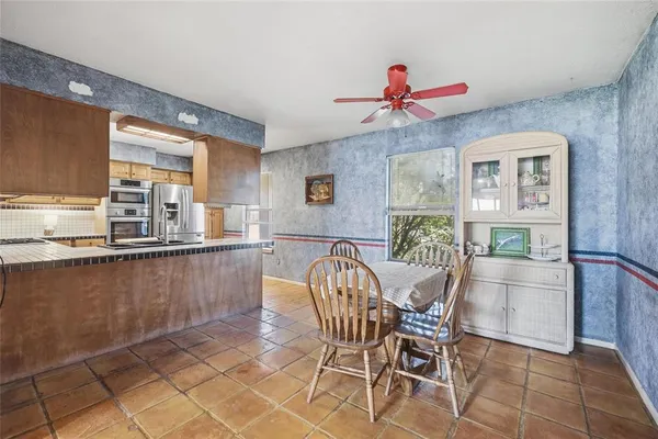 a dining room with furniture and window