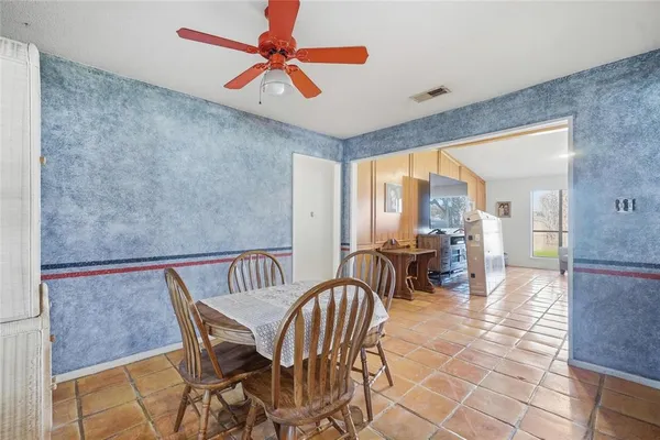 a view of a dining room with furniture window and outside view