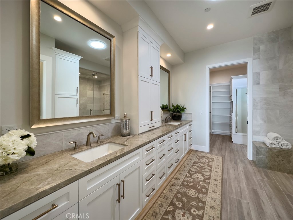 33971 Nauticus Isle Dana Point, CA 92629 - Photo 13 of 27 a large bathroom with double vanity and a mirror