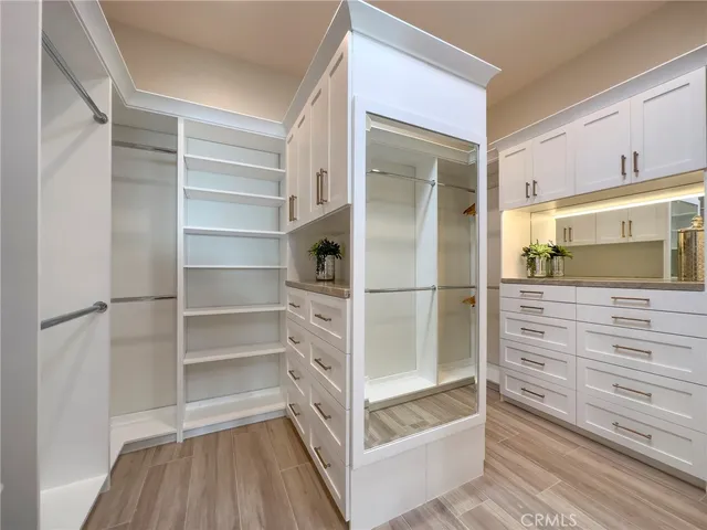 a bedroom with a bed and a lamp