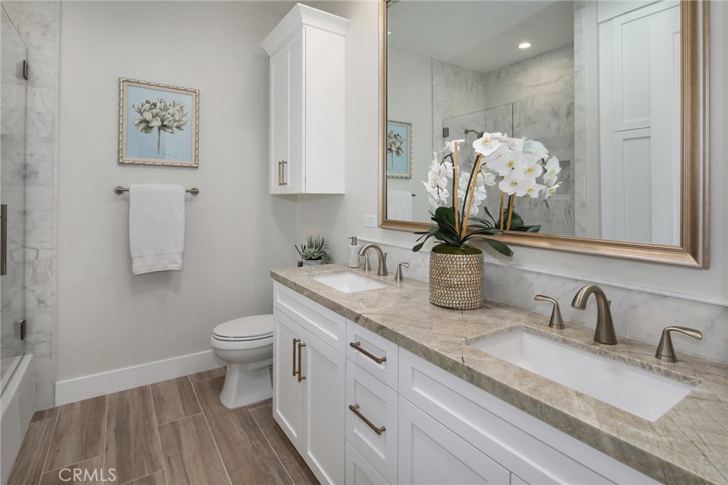 33971 Nauticus Isle Dana Point, CA 92629 - Photo 17 of 27 a bathroom with a sink a toilet and a mirror