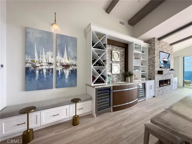 a kitchen with a sink appliances and cabinets