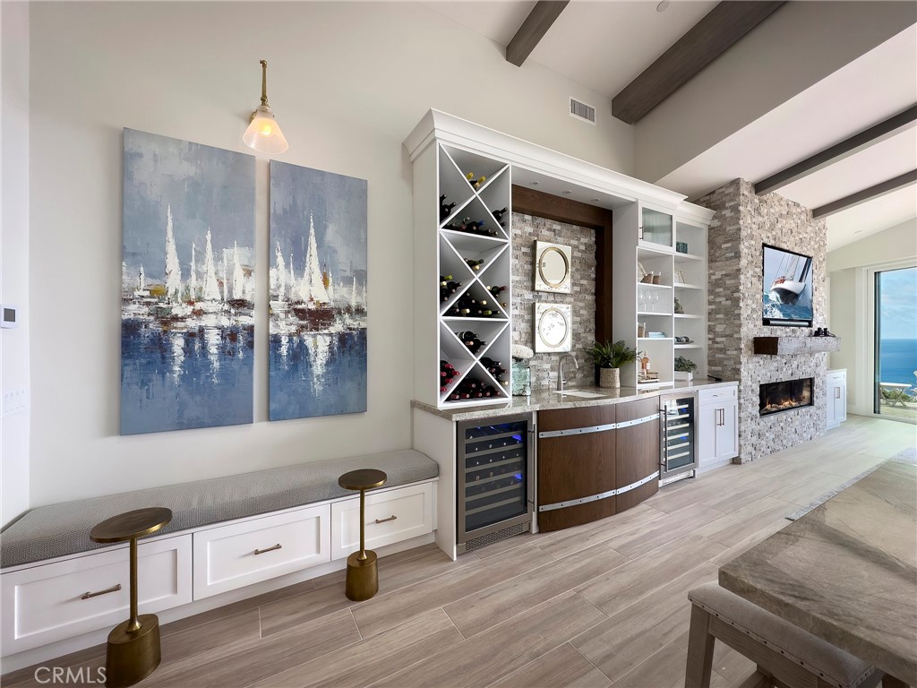 33971 Nauticus Isle Dana Point, CA 92629 - Photo 7 of 27 a kitchen with counter top space and wooden floor