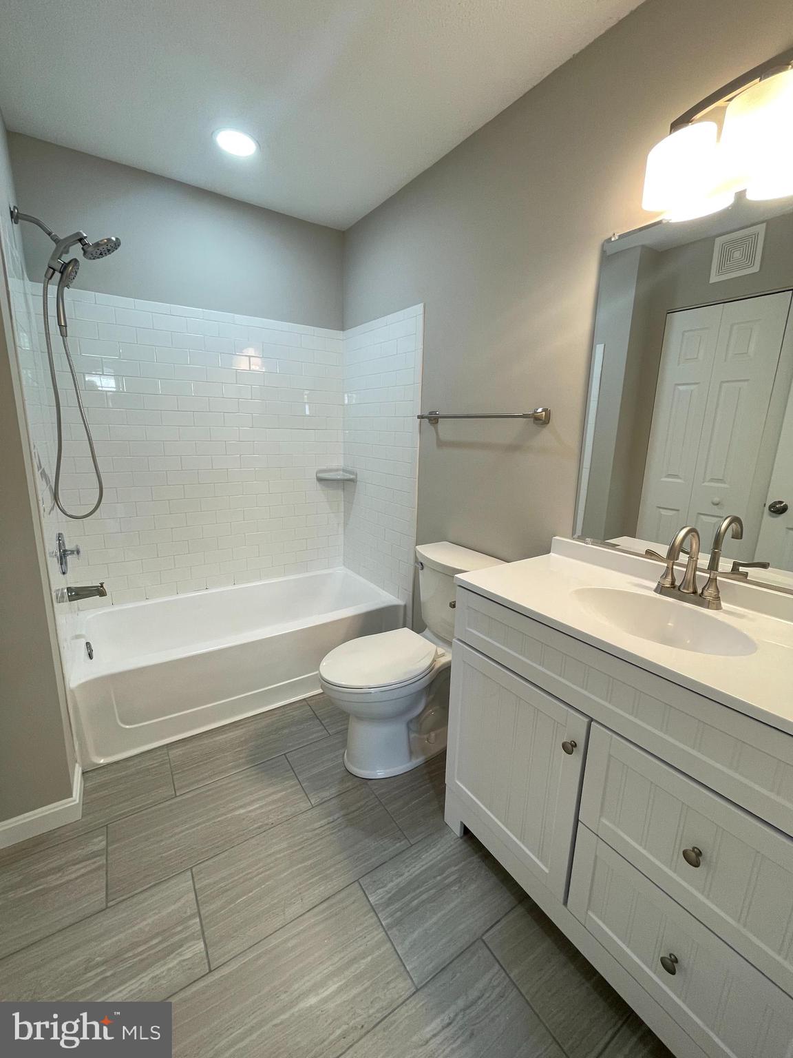 102 Fort Evans Road Southeast, Unit B Leesburg, VA 20175 - Photo 10 of 14 Primary bath with new tile, vanity & new lighting