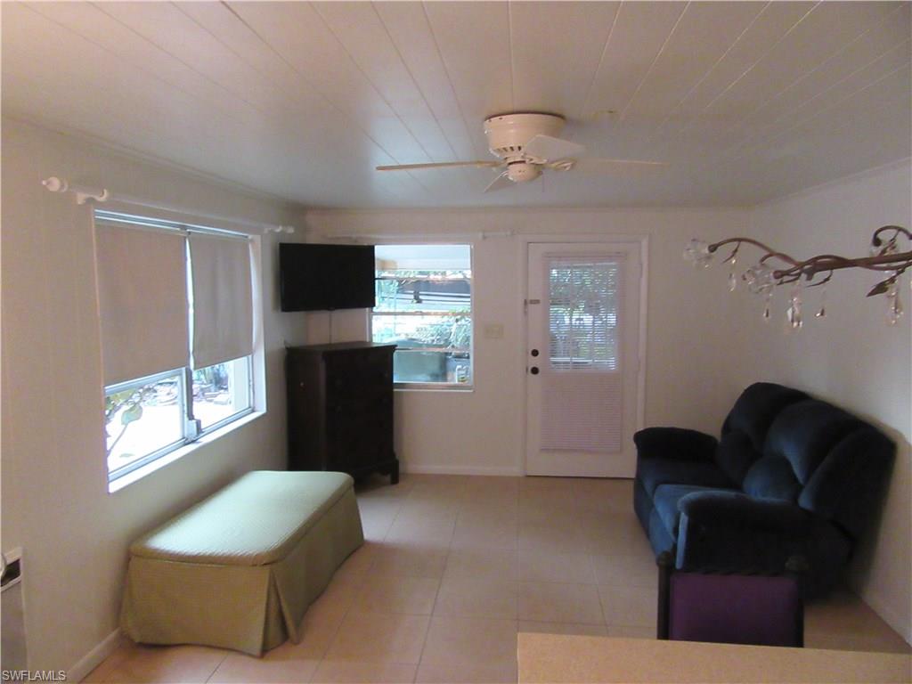 1009 Ridge Street Naples, FL 34103 - Photo 5 of 10 a living room with furniture and a flat screen tv