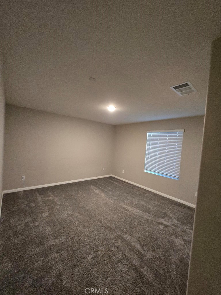 14196 Hercules Street Hesperia, CA 92345 - Photo 11 of 21 an empty room with a natural light