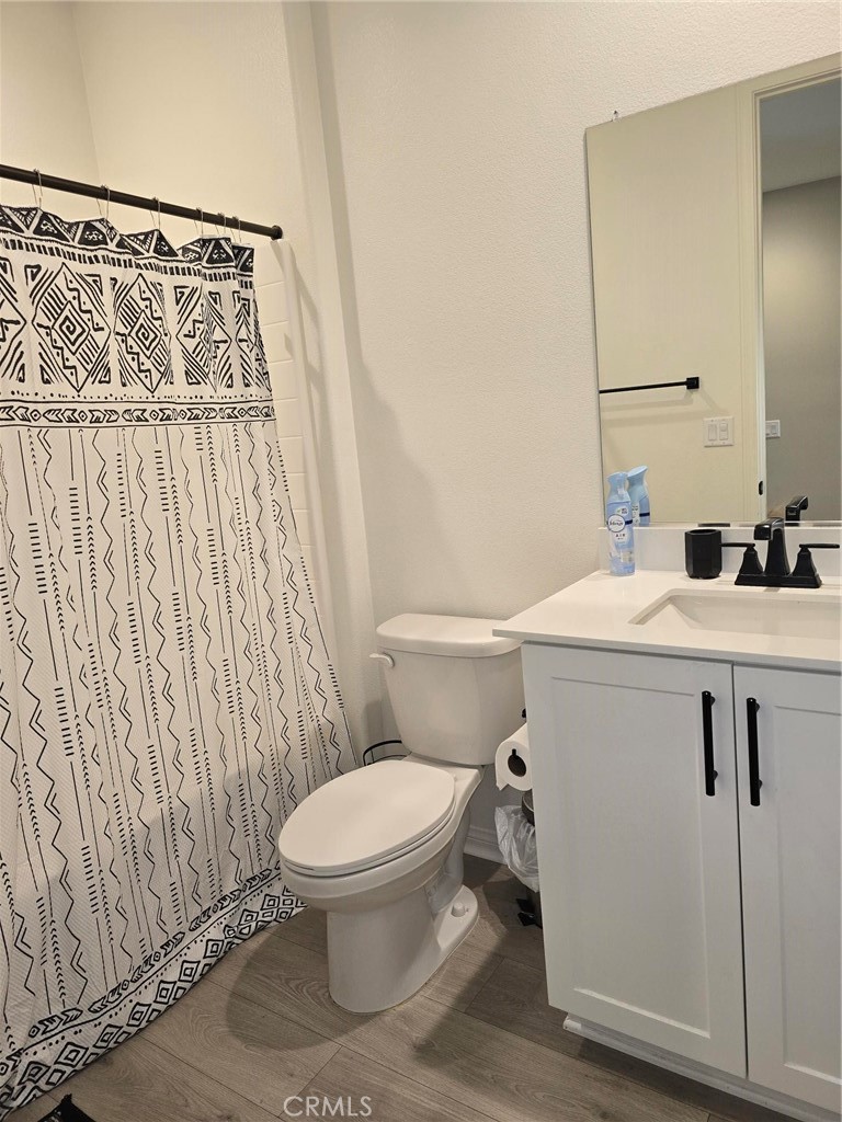 14196 Hercules Street Hesperia, CA 92345 - Photo 17 of 21 a bathroom with a sink and a toilet